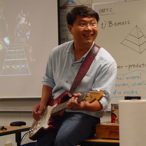 teacher playing guitar